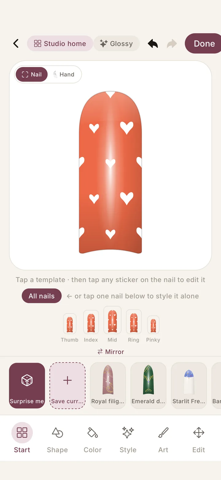 Nailly nail design editor: heart print on a coral nail, styled per finger